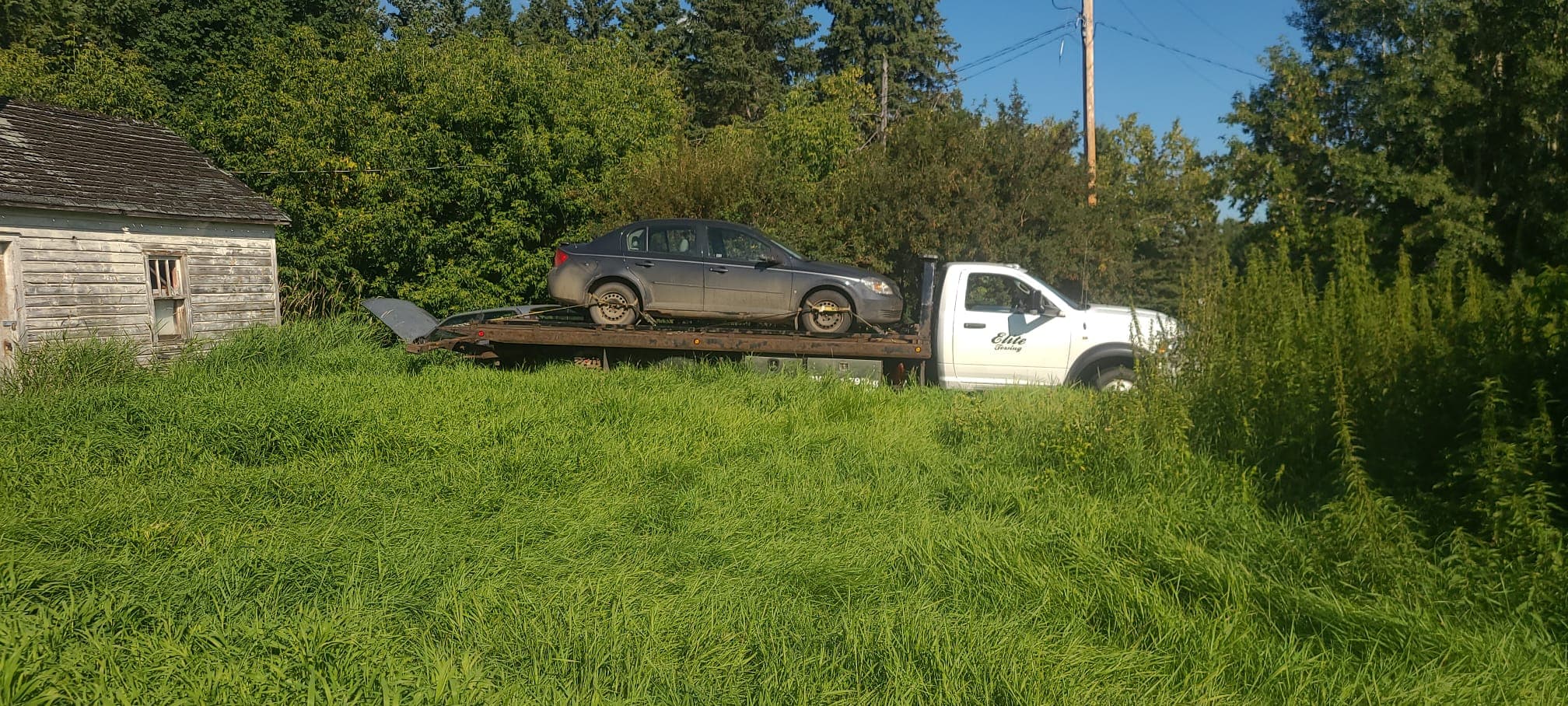 A tow truck carrying a vehicle in Edmonton