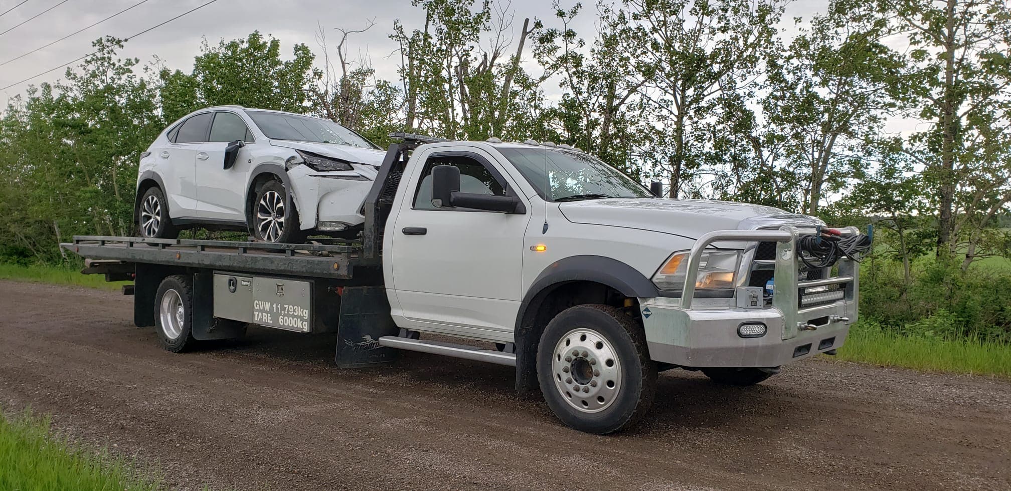 A flatbed tow truck working in Edmonton conditions